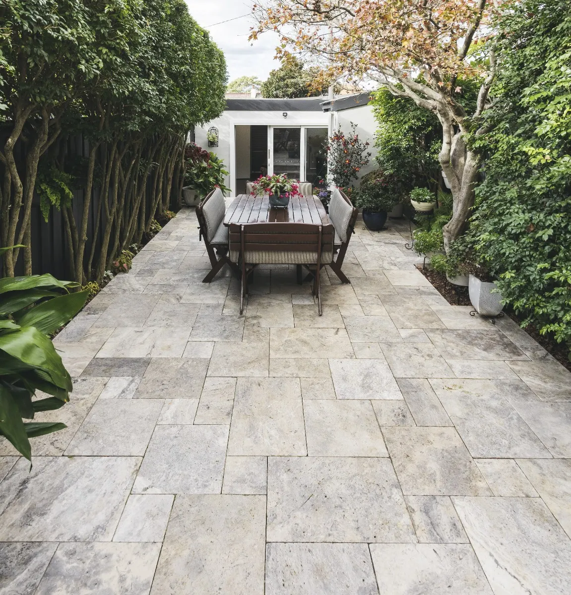 French pattern paved outdoor entertaining space